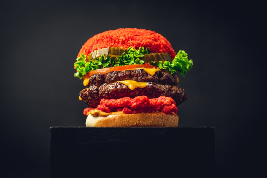 Cheetos beef burger loaded with fiery hot crispy Cheetos and cheese